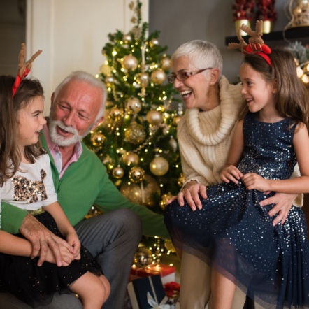 Christmas older couple with grandchildren